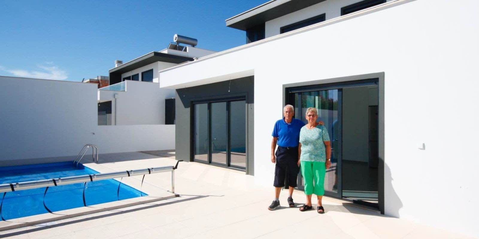 Vic and his wife the day they received the keys to their new build villa in Portugal