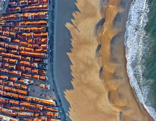 Aerial view of Nazare beach and village rooftops