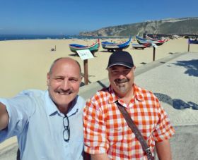 Immo Portugal clients Luc and Luc at Nazare Beach in Portugal